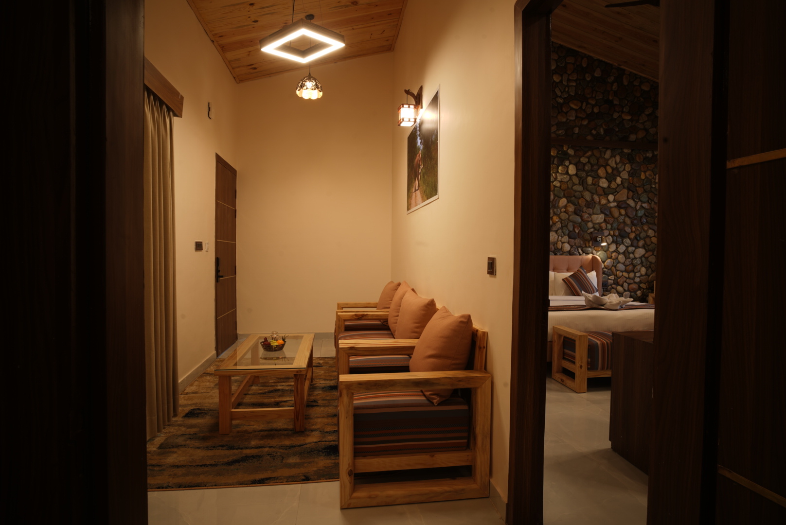 Banyan Suite spacious living and seating area with warm wooden interiors at The Banyan Retreat