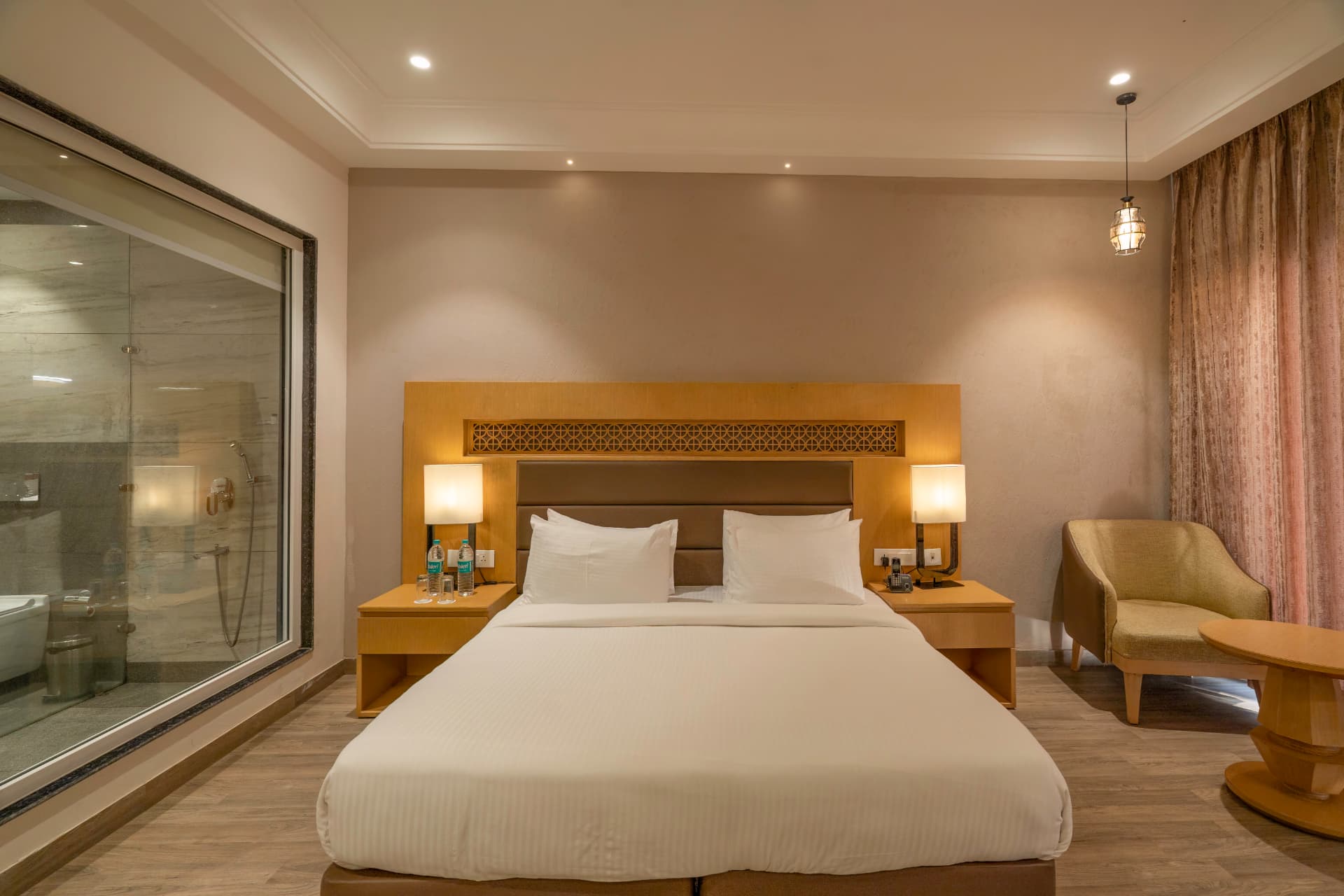 Deluxe Room interior with king bed in Corbett