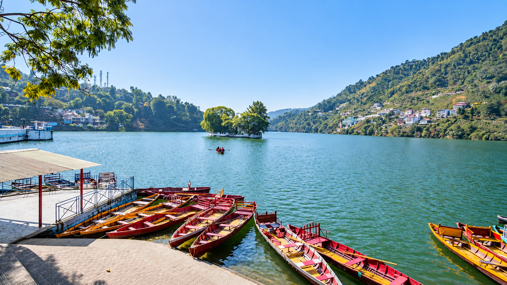 Colourful boats along the Bhimtal Lake promenade