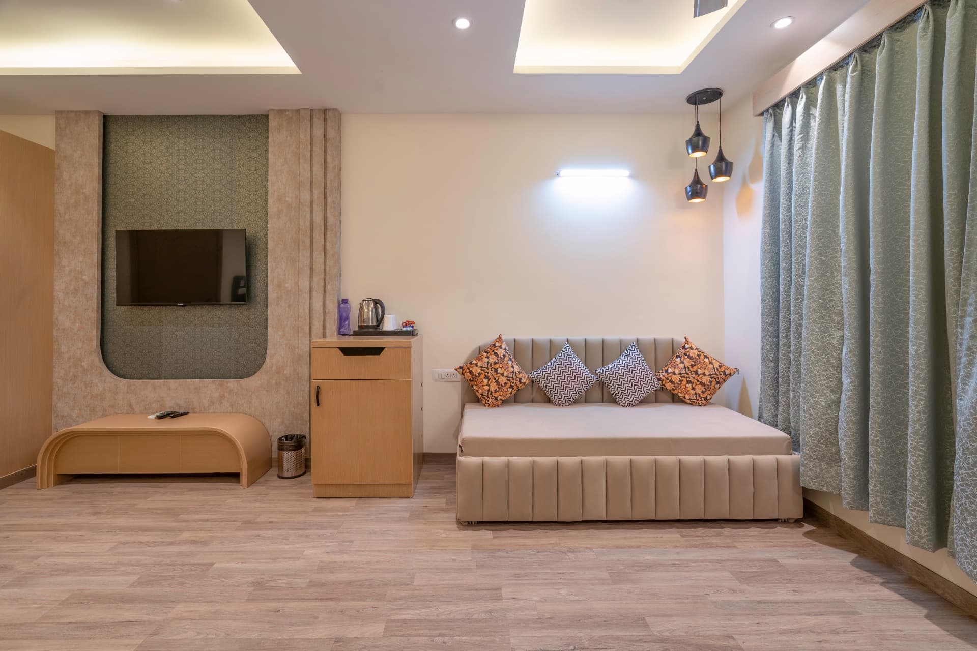 Supreme Room seating area with daybed, TV unit and soft furnishings