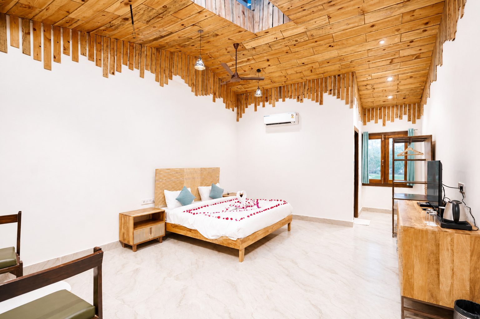 Wardrobe, tea tray and window seating in the Cotton Tree Superior at La Perle River Resort