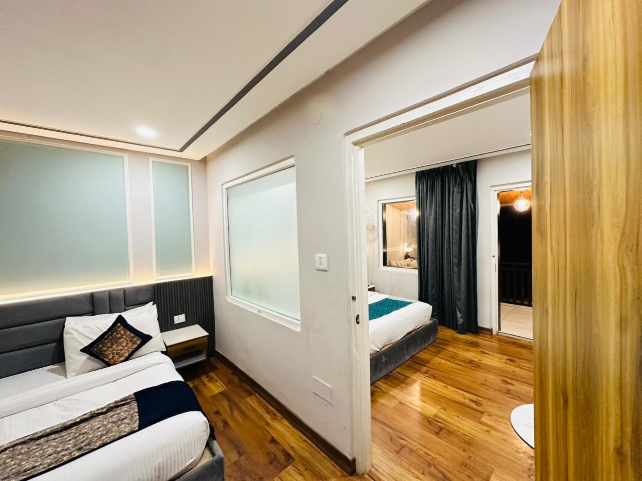 Family Suite connected rooms with balcony access and lake views at Excel Hotels Nainital