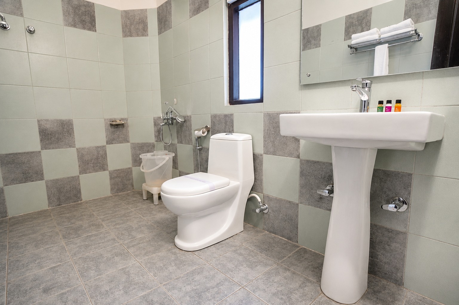 Bathroom with shower and vanity in the Cotton Tree Room