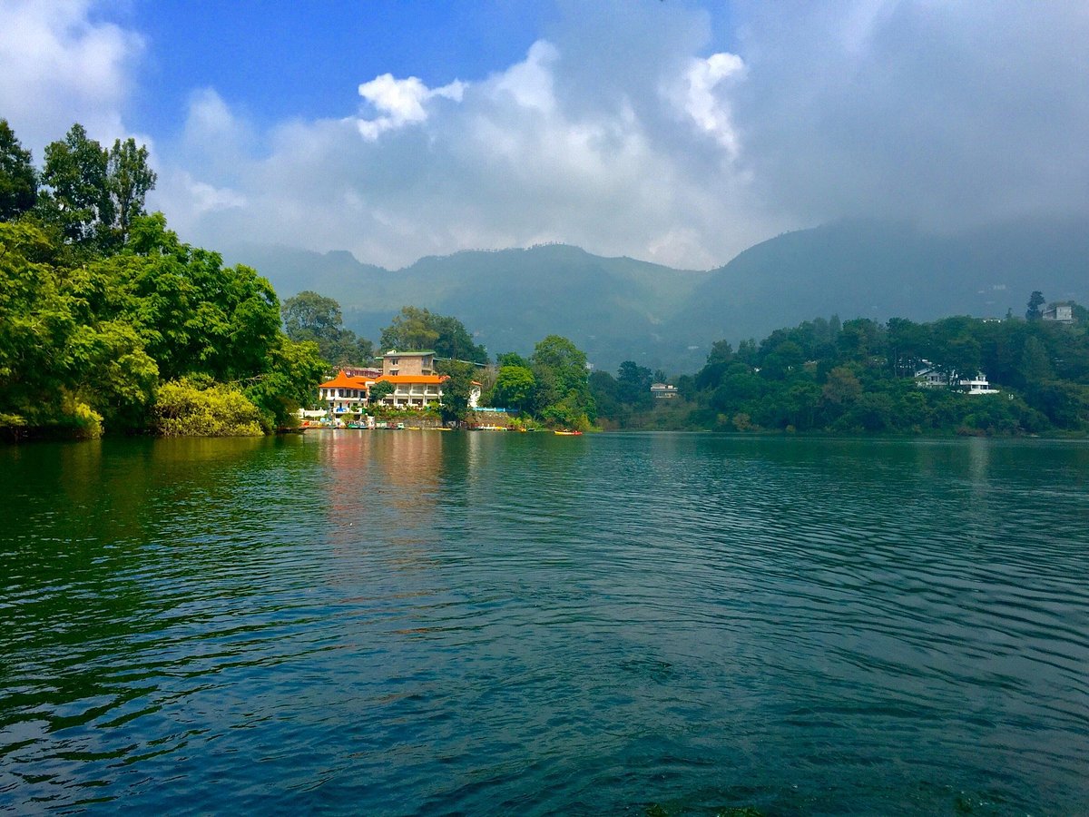 The nine-cornered lake at Naukuchiatal surrounded by wooded hills