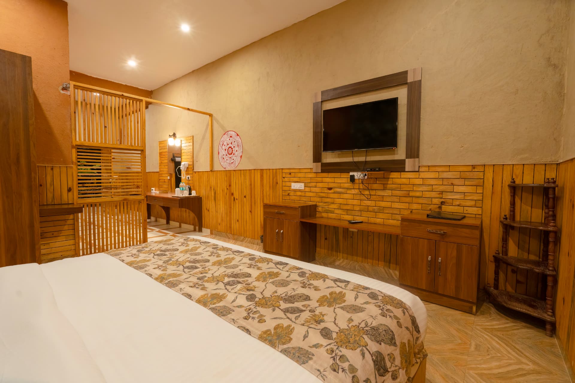 Banyan Gaon bed facing the LED TV and wooden console