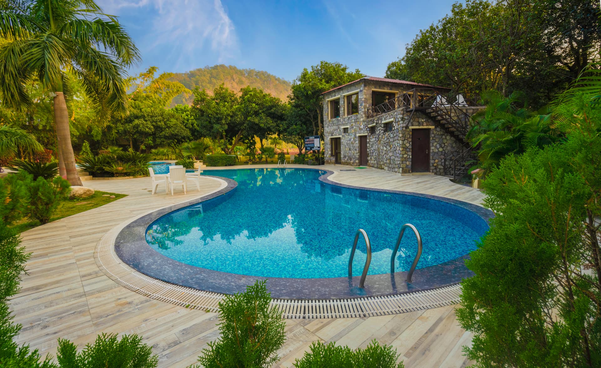 Mango Bloom River Resort swimming pool and poolside setting