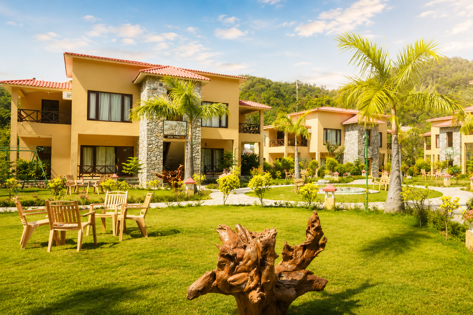 Cottages and lawns at Mango Bloom River Resort, Jim Corbett