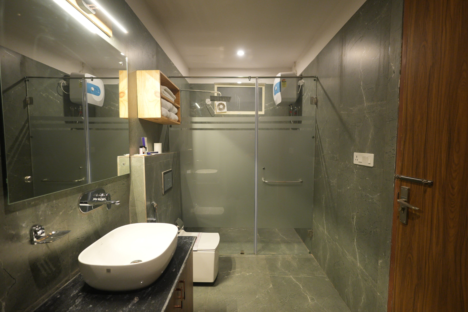 Hornbill Suite modern bathroom with forest-facing window at The Banyan Retreat, Jim Corbett