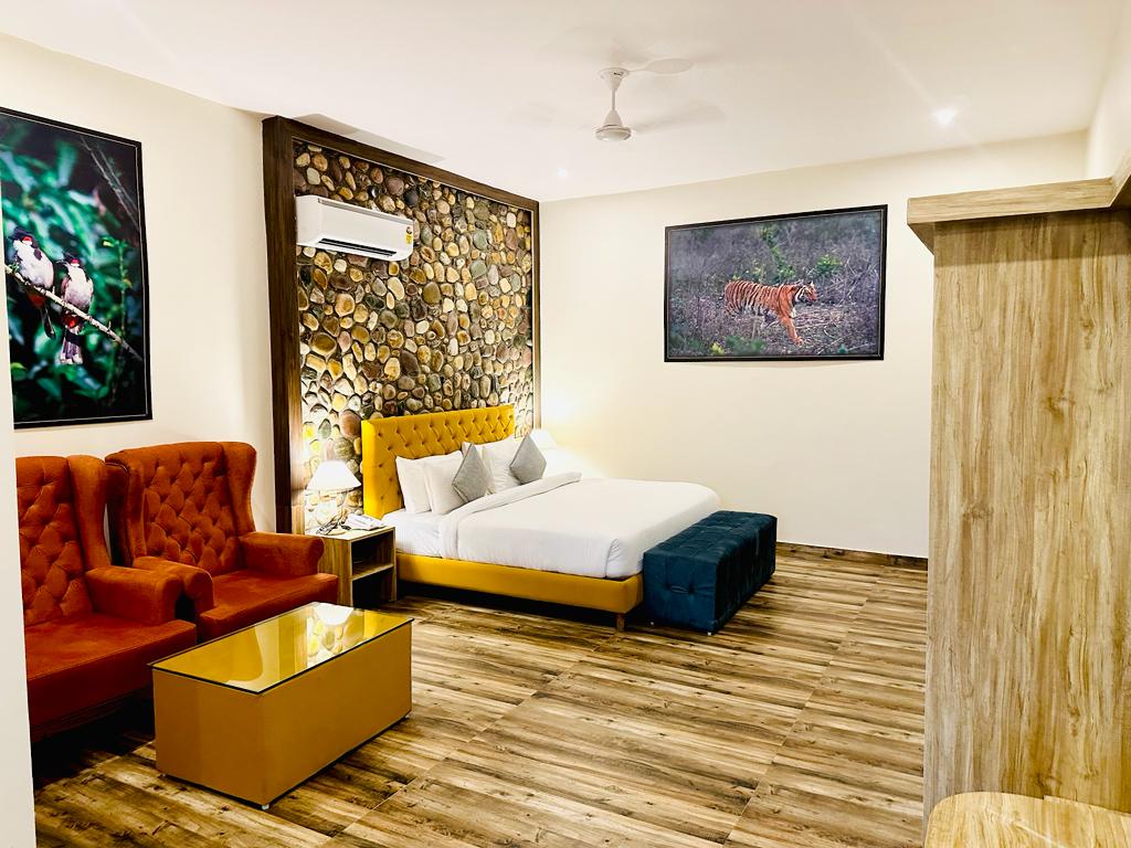 Kosi Retreat bedroom at The Banyan Retreat with seating area and forest-facing window
