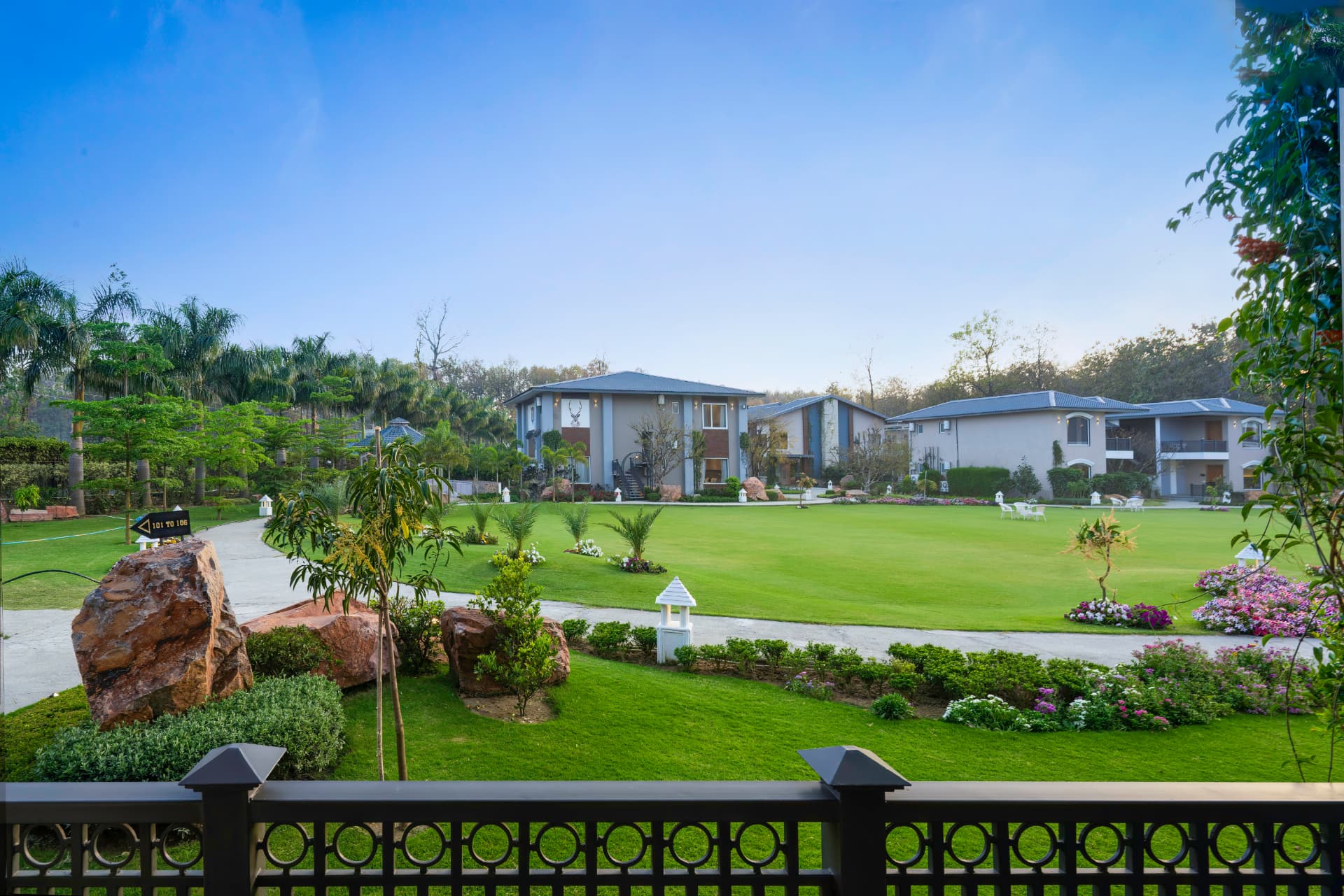View across the central lawn and garden pathways at Excel Hotels & Resorts, Kotabagh