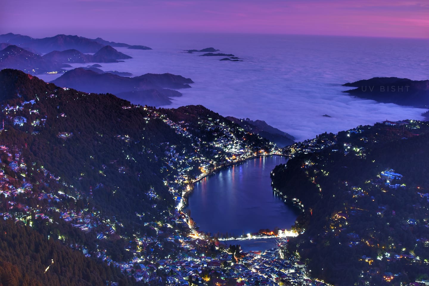 Night view of Nainital town, Naini Lake and the valley from Naina Peak, with clouds lit by city lights