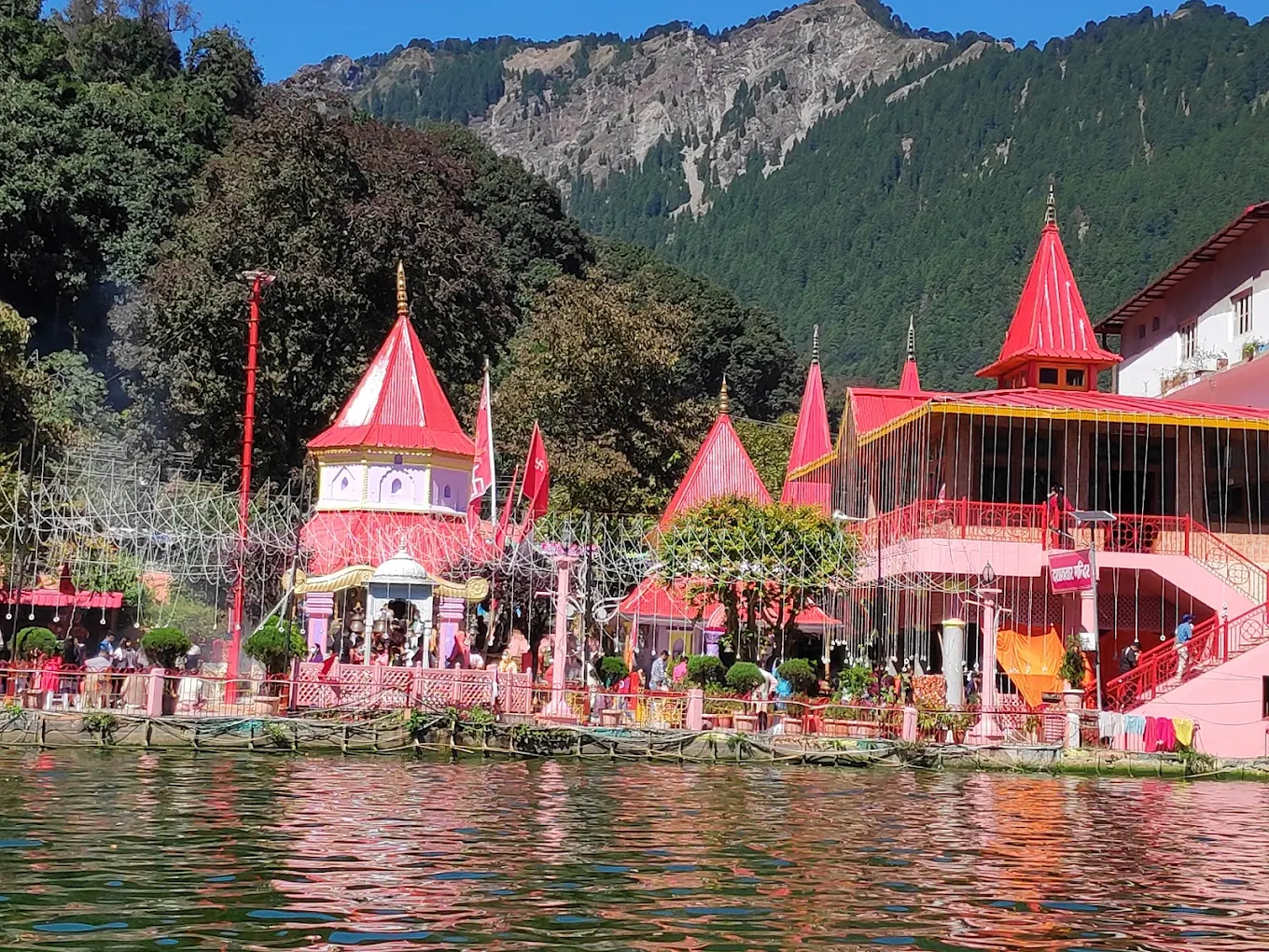 Naina Devi Temple complex with red spires and shrines beside Naini Lake, Nainital