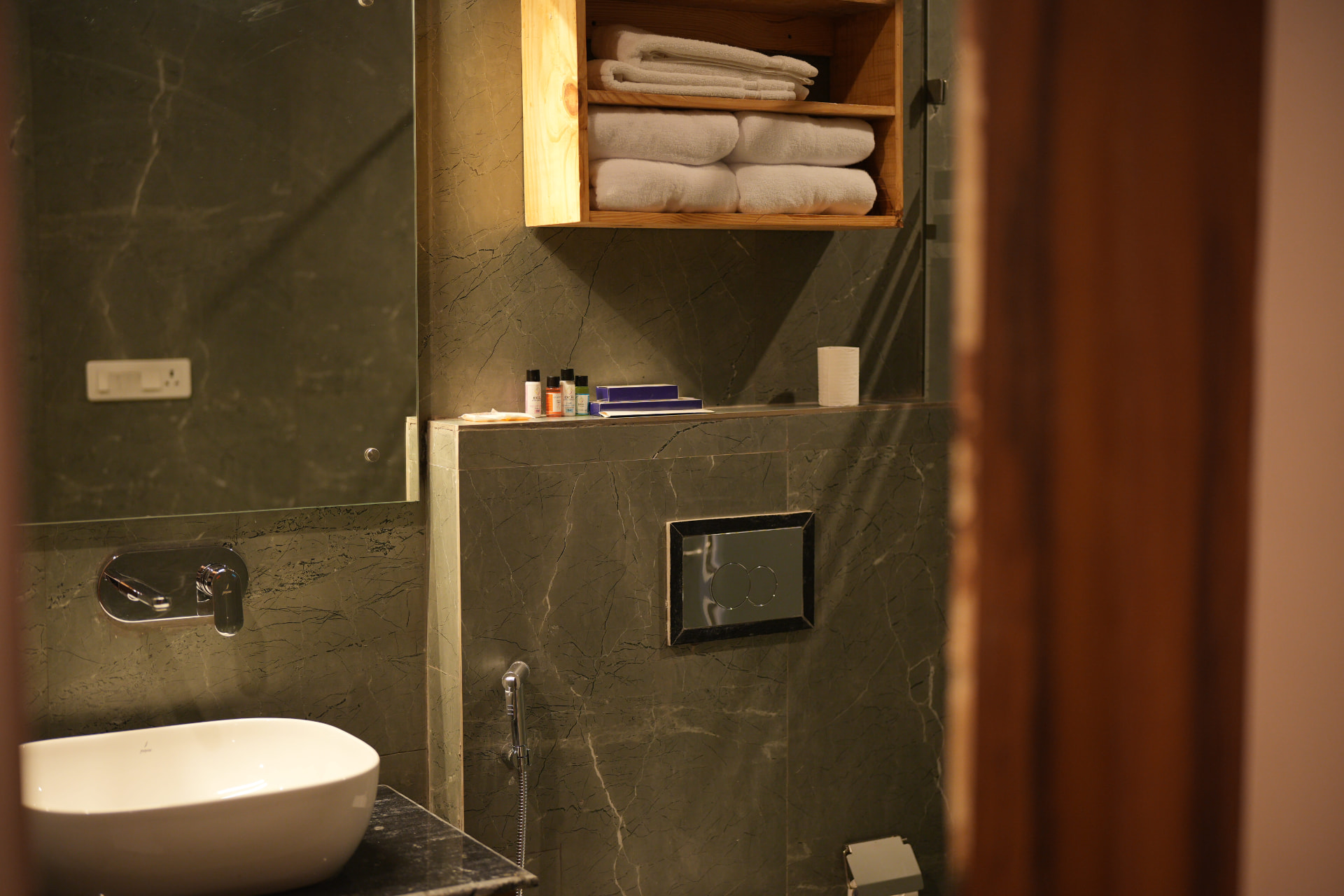 Hornbill Suite at The Banyan Retreat Corbett — bathroom detail with folded towels and toiletries