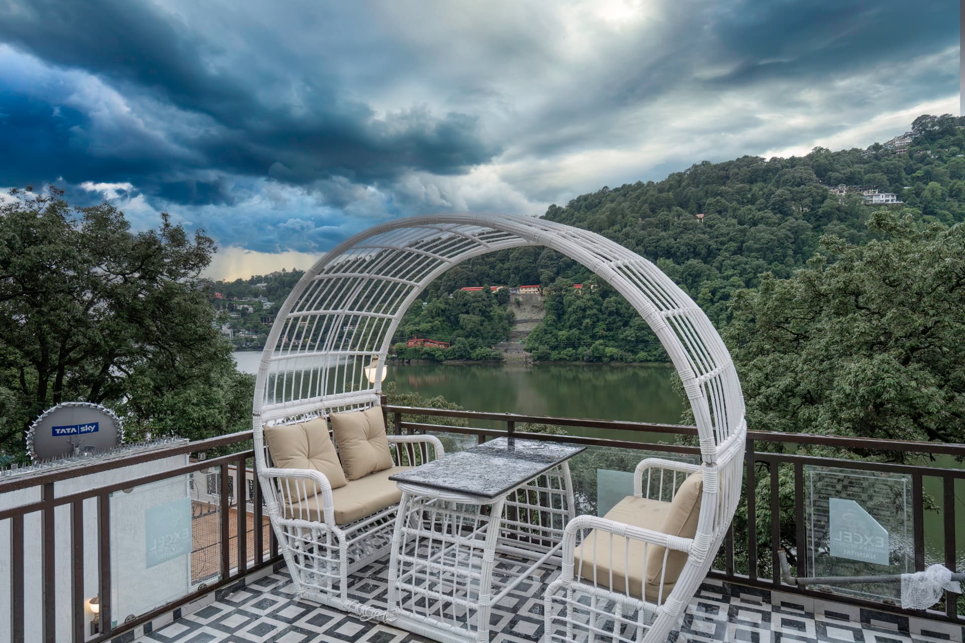 Lake-view terrace seating overlooking Naini Lake and the surrounding hills