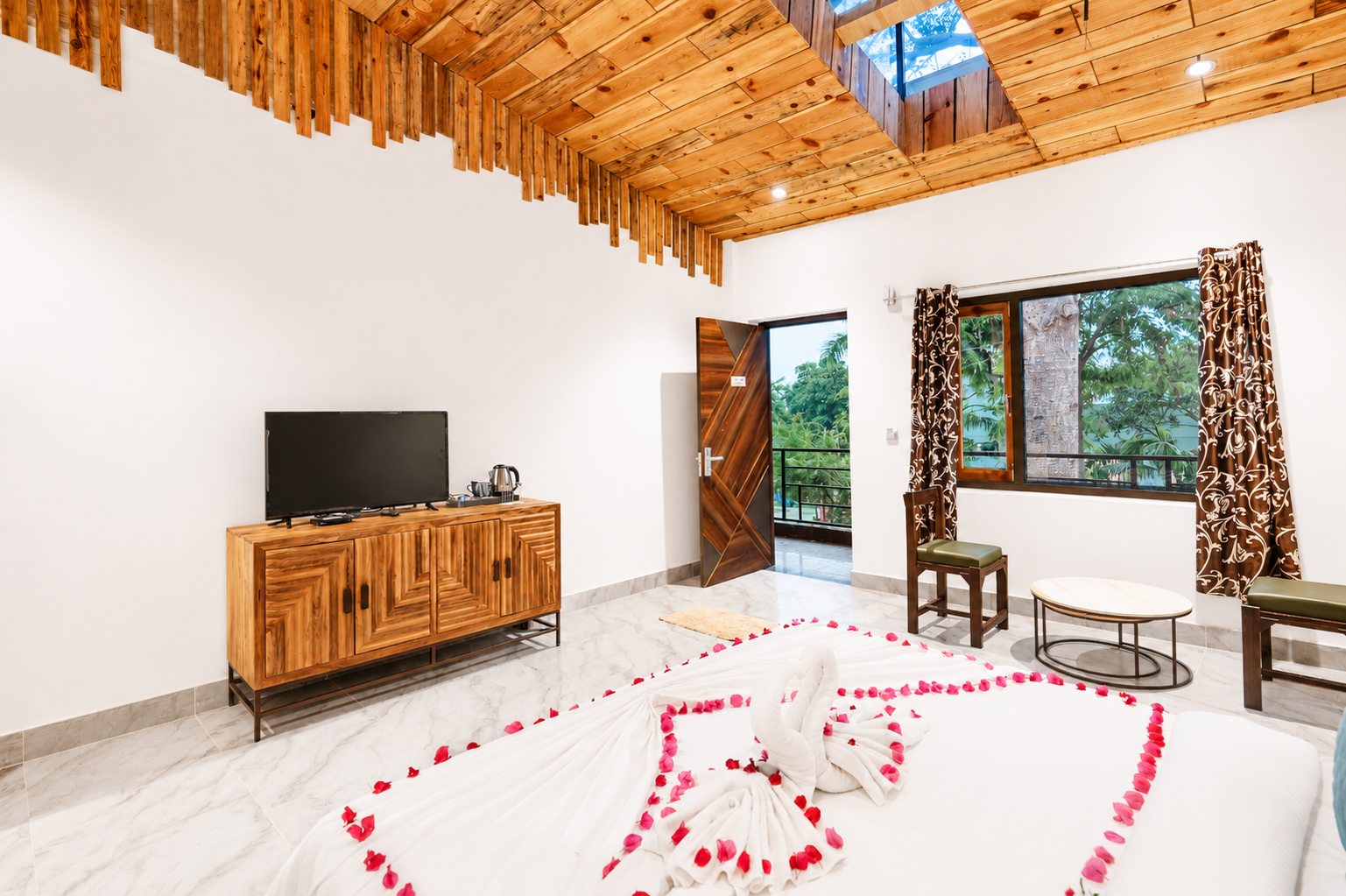 Seating area beside the window in the Cotton Tree Superior at La Perle River Resort