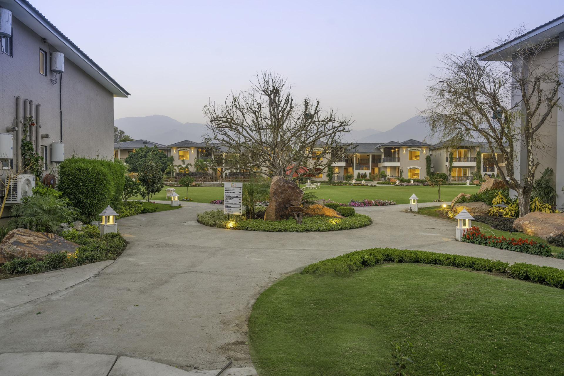 Central lawn and garden courtyard with the Himalayan foothills beyond, Excel Hotels & Resorts, Kotabagh