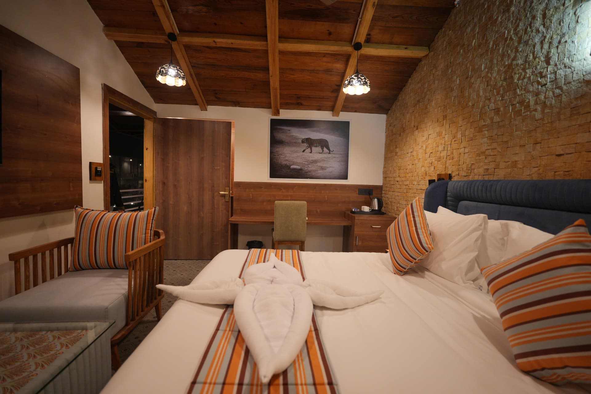 Woodpecker Room interior with wildlife artwork, desk and seating area