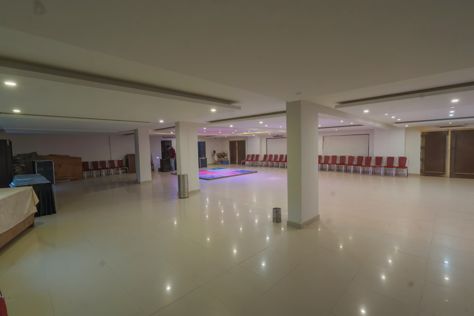 Large indoor corporate event hall at Excel Hotels & Resorts Bhimtal
