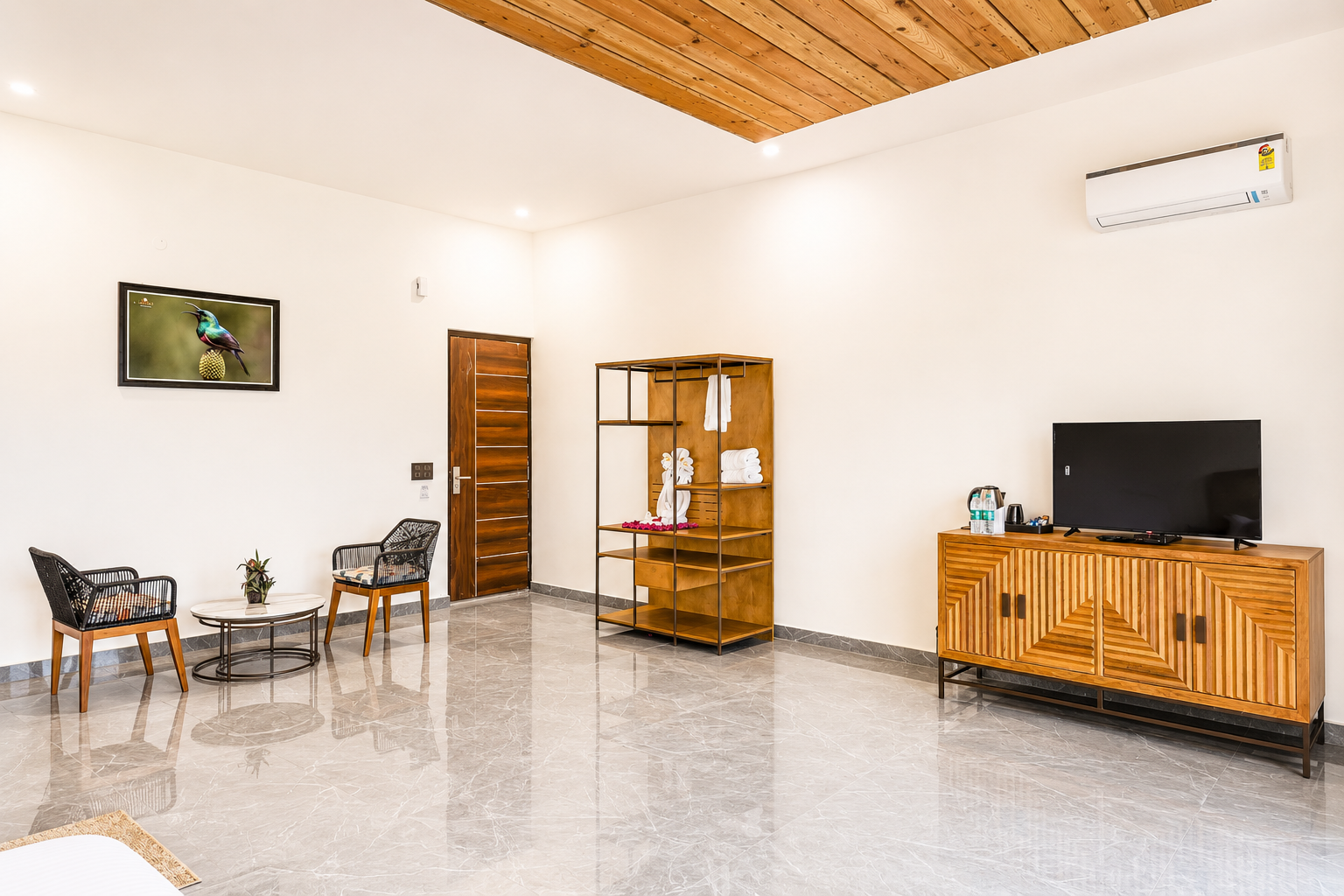 Wardrobe, seating and entertainment console in the Jungle Suite at La Perle River Resort