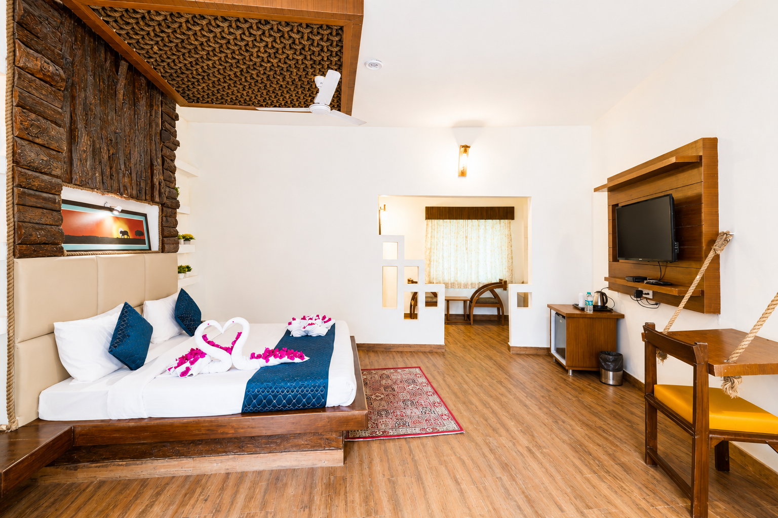 King bed and two single beds inside the Elephant Park room at La Perle River Resort