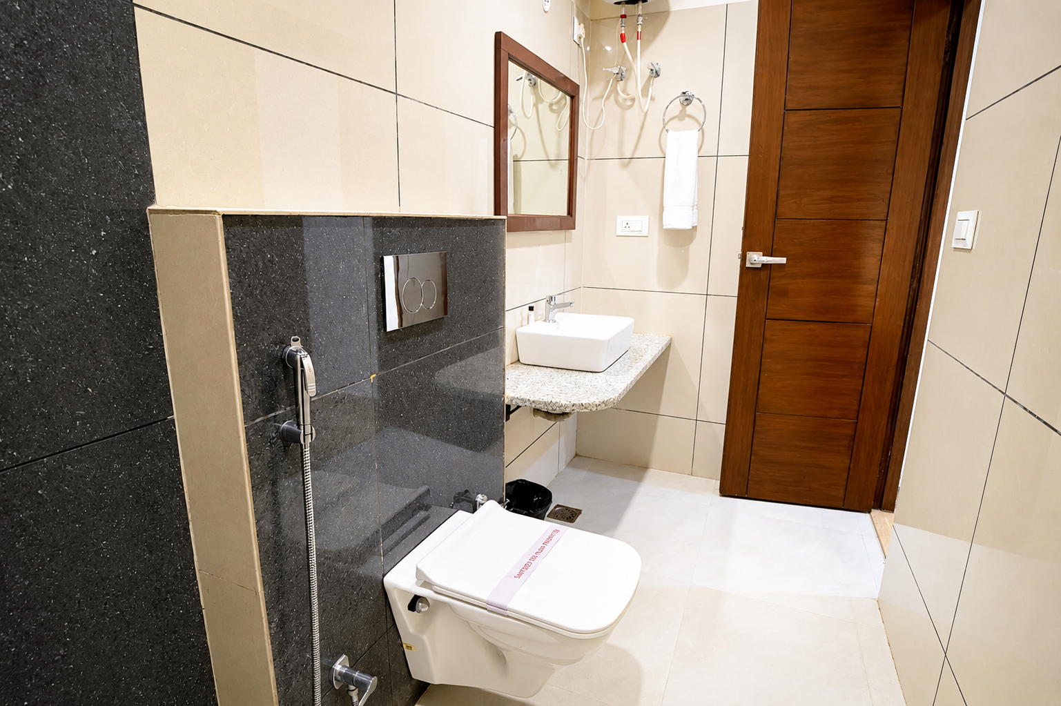 Pine Room bathroom with modern fittings, vessel sink and tiled finish