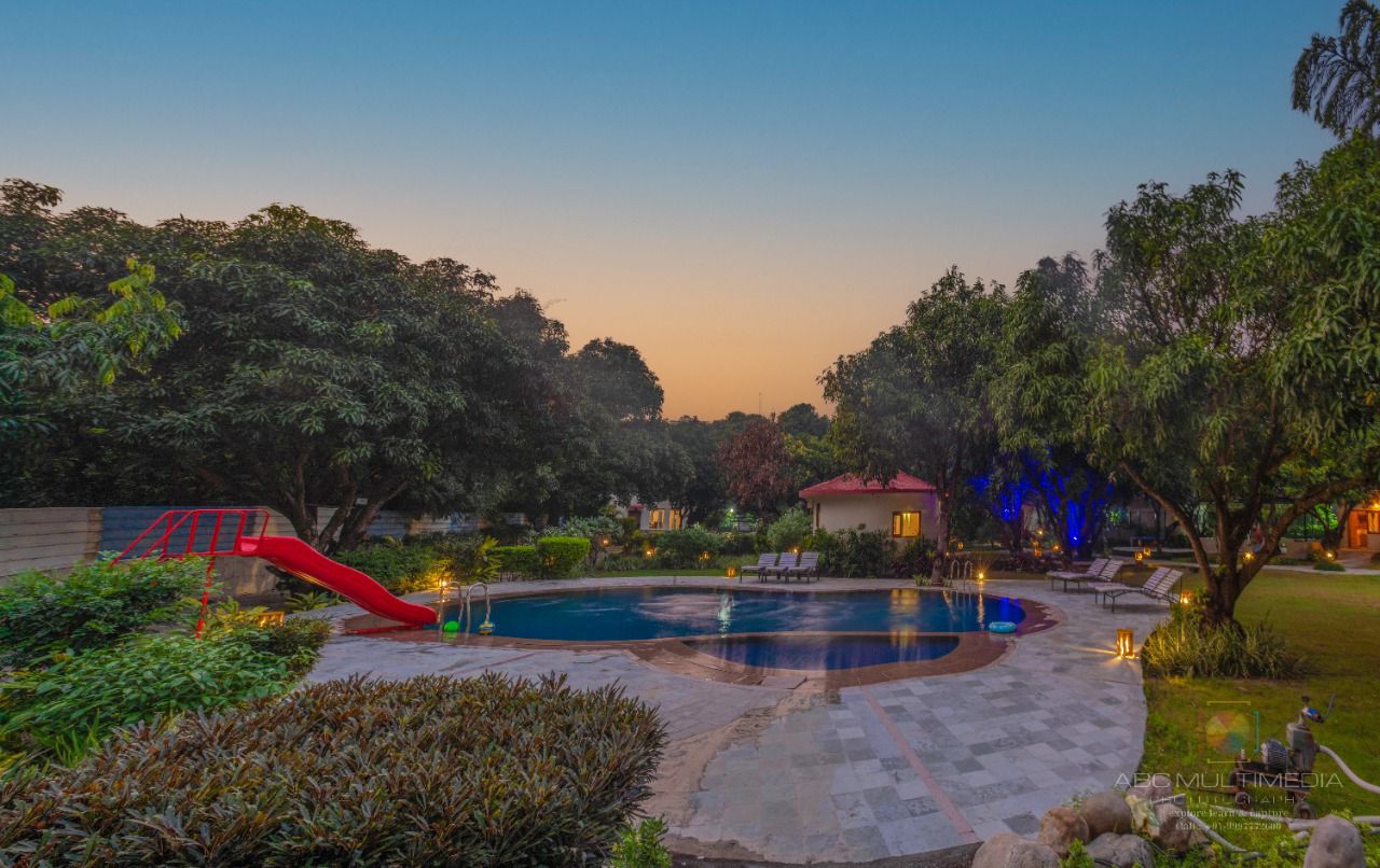 Pool at twilight at La Perle River Resort, Jim Corbett