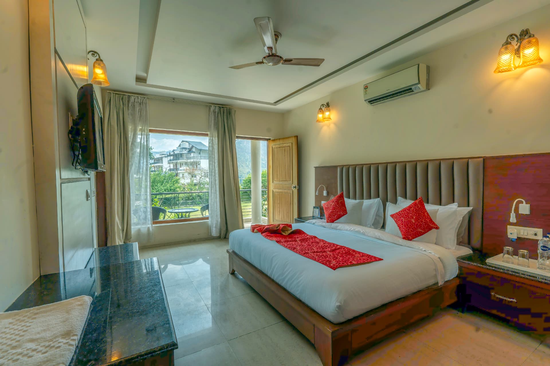 Family Cottage bedroom with private balcony and mountain view at Excel Hotels & Resorts Bhimtal