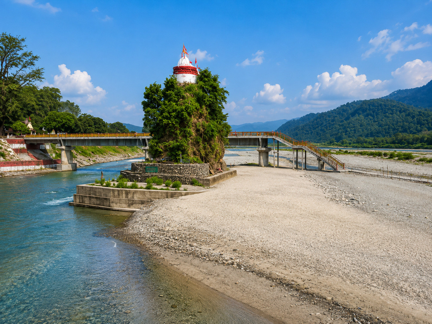 Girija Devi Temple rising from a rocky island in the Kosi River with a pedestrian bridge and forested mountains, Jim Corbett