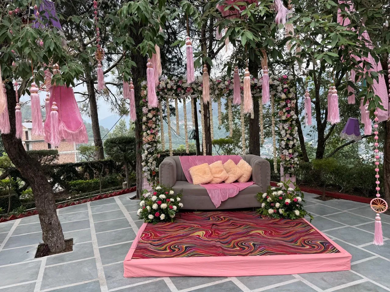Ruby Lawn with pink floral celebration seating at Excel Hotels & Resorts, Bhimtal